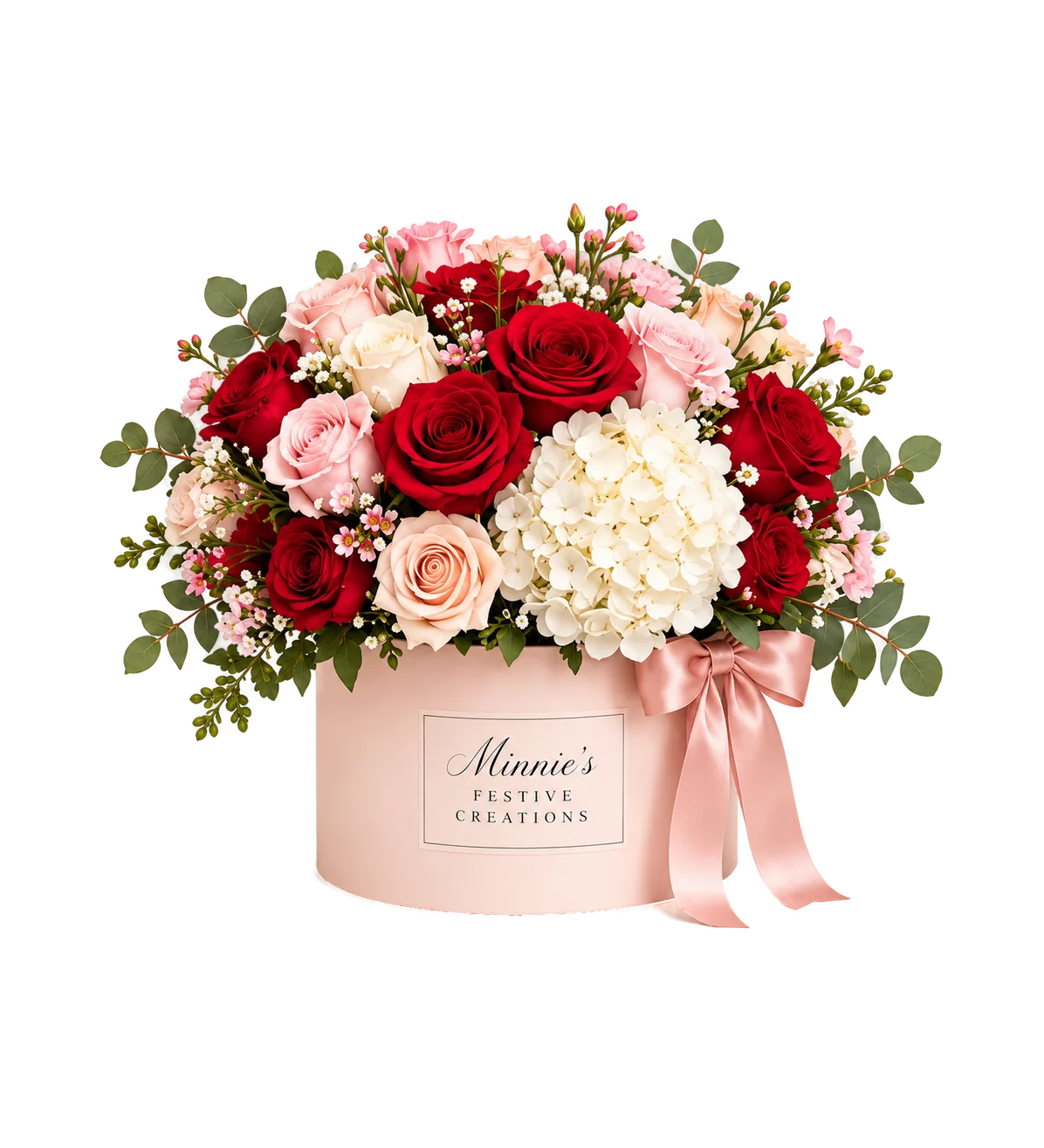 Deluxe arrangement of red and pink roses with white hydrangea and eucalyptus in a round blush box
